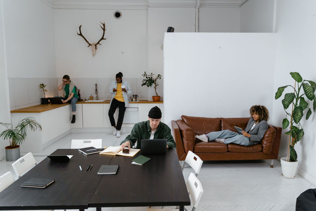 heros-img Diverse team working in a modern office, utilizing digital devices for collaboration